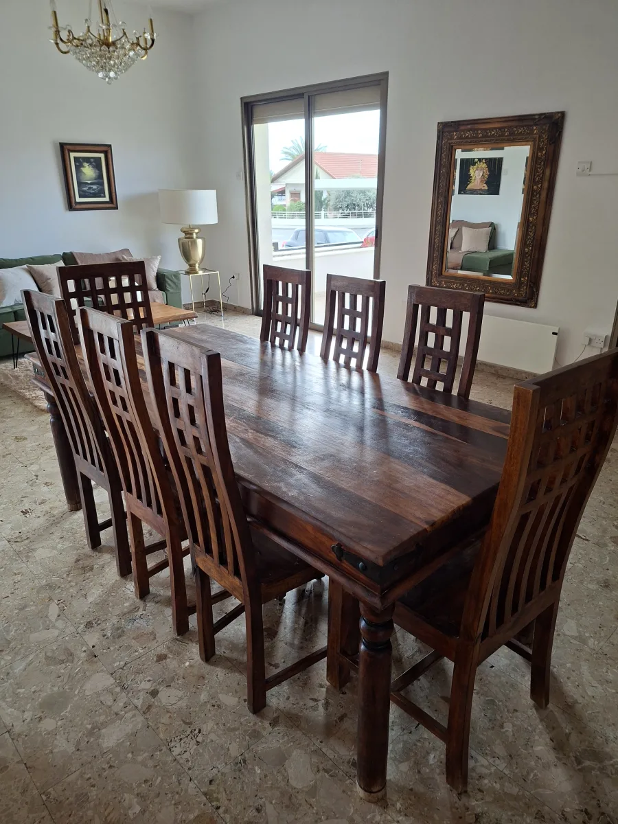 Wooden table with 8 chairs