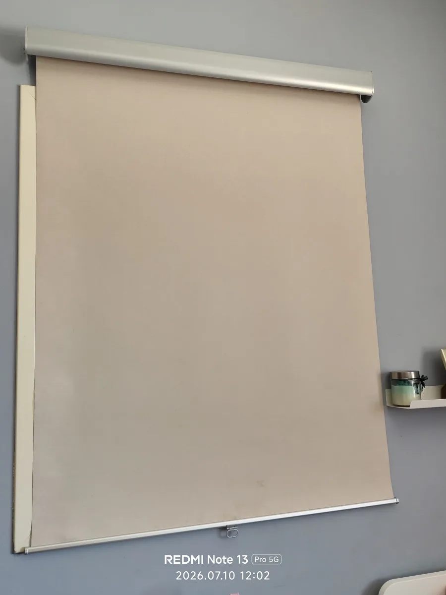 A beige roller blind